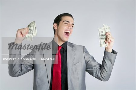 Businessman young with dollar notes suit and tie on gray background