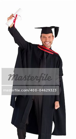 Happy attractive graduate smiling at the camera