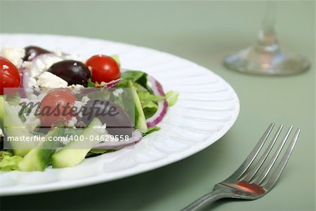 A delicious greek salad on a table.