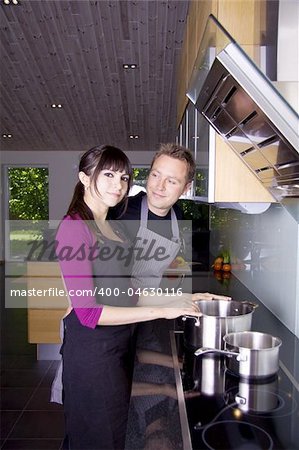 Couple cooking together in a modern kitchenkitchen