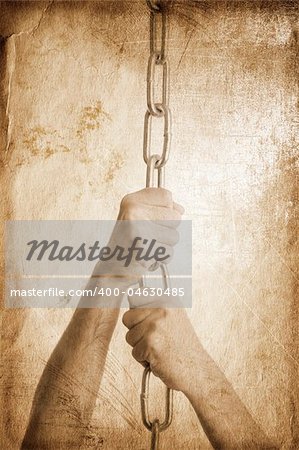 hands of man with metal chain special toned great for your design and art-work