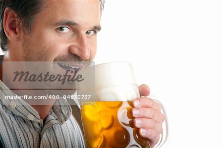 Close-up of Bavarian man which drinks out of Oktoberfest beer stein