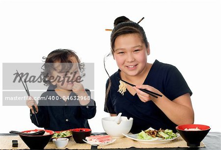 Two asian children have dinner,isolated on a white background.