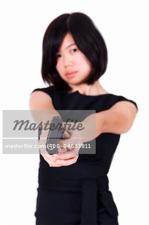 Beautiful Asian bodyguard woman holding a gun.