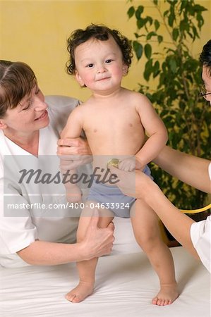 Cheerful baby at the doctor,passes medical examination.