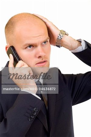 young businessman with bad news on his cell phone