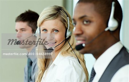 Businesspeople wearing headsets at work