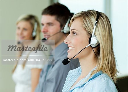 Businesspeople working with headsets in an office