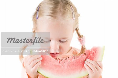 Shot of little girl eating watermelon isolated on white