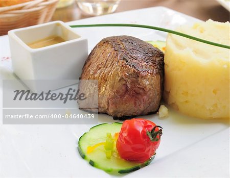 juicy veal - beef meat with tomato and potatoe