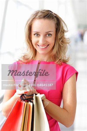 Woman with bags in shopping mall