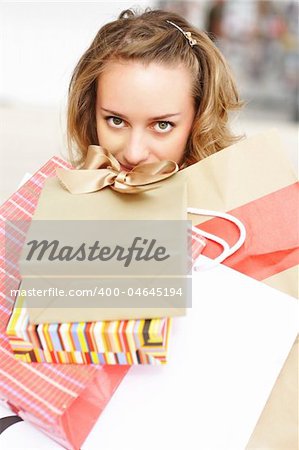 Woman with bags in shopping mall