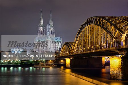 Cologne cathedral and railway bridge at night