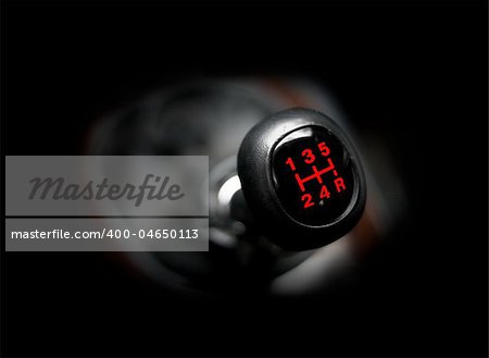 Closeup of a car 5 speed gearstick.