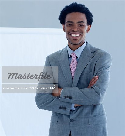 Confident and smiling Afro-American businessman in a presentation