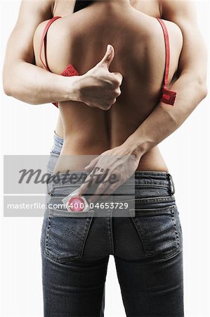 man taking red condom on woman's pocket and thumb up on woman's back for safe sex concept
