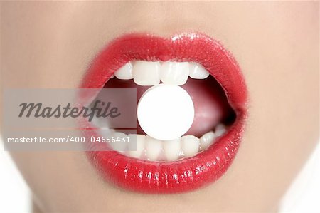 Beauty woman mouth with red lips and medicine pill