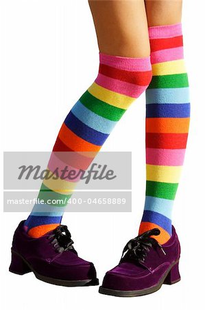 Awkward, bashful, schoolgirl legs in multicolored knee-his & chunky purple suede shoes.