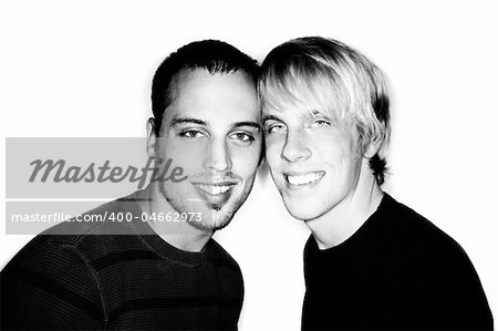 Two handsome men posing for portrait on white background