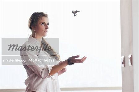 happy young woman throw keys from their apartment and home in ai and representing concept of joy and financial freedom