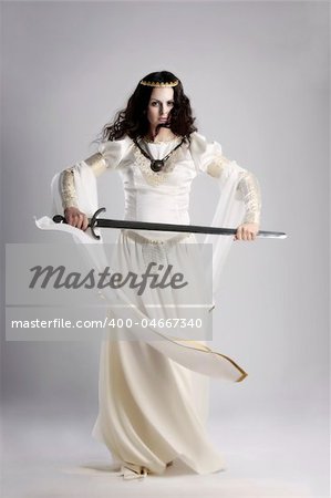 A lady with sword in traditional medieval dress