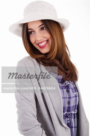 Young model with spring clothing and white hat on a white isolated background