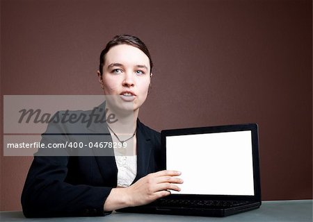 An attractive power woman shows a presentation