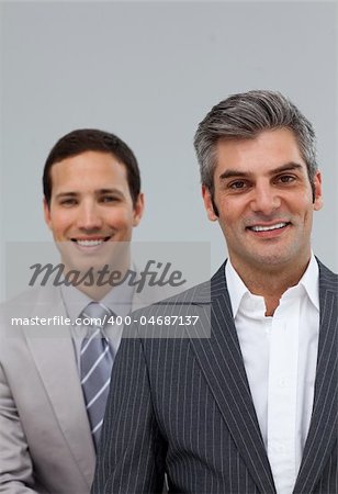 Portrait of two businessmen smiling at the camera