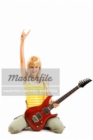 passionate rock girl playing an electric guitar on her knees