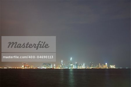 The night skyline over the persian gulf of the city of Doha, Qatar