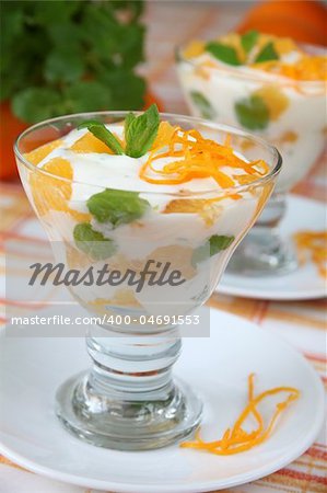 Refreshing mint yogurt dessert with oranges. Shallow DOF