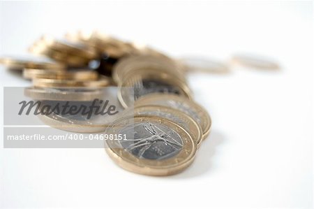 Many coins isolated on white background