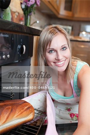 Radiant woman baking bread in the kitchen