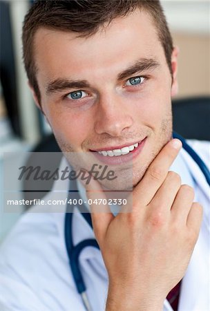 Portrait of a cheerful male doctor smiling at the camera