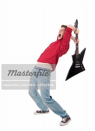 studio shot pictures on isolated background of a angry man holding a guitar and trying to brak it