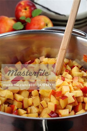 Chopped nectarines in a pot to make a delicious jam