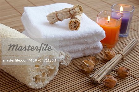 wellbeing concept with towel, candle and plants