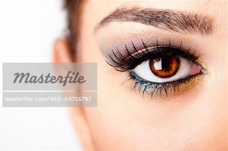 Fashion beautiful female brown watchful eye with long black eyelashes mascara, isolated.