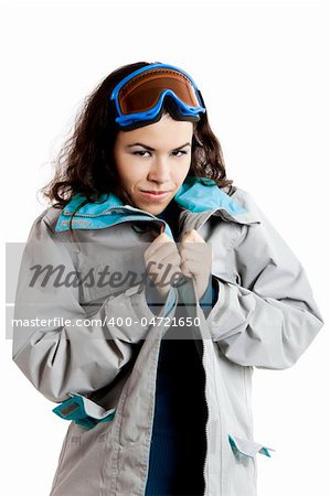 Portrait of a beautiful young girl wearing a winter coat and snow glasses