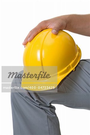 Yellow helmet at man hands isolated on a white