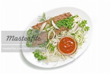 minced mutton chop with sauce and vegetables at dish