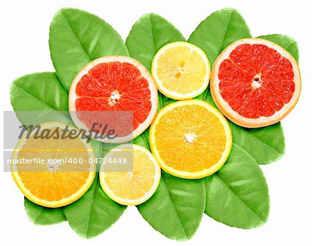Set of cross citrus fruits on green leaf. Isolated on white background. Close-up. Studio photography.