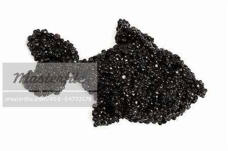 Fish figure made of black Russian caviar, isolated on white.