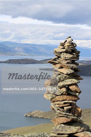 Landscape, view from hill on Baikal.Siberia. A conglomeration of stones made by shaman.