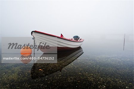 fishing boats a foggy day