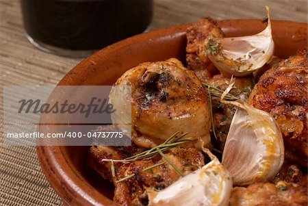 Traditional Spanish garlic chicken served in a clay pot