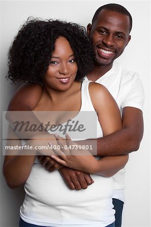 Loving black couple hugging
