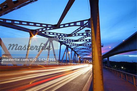 light trails from vehicles on the mega bridge in evening time