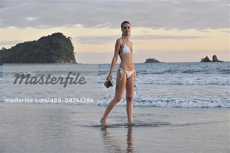 Young beautiful on a beach. One. Coast Pacific of ocean in Costa Rica.