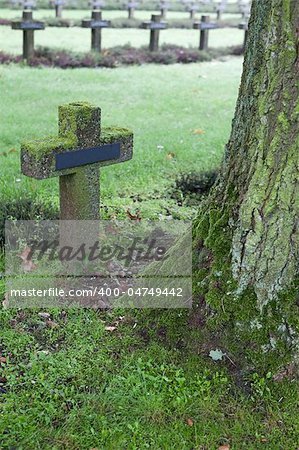 crosses at cemetery in autumn mist stone tombstones